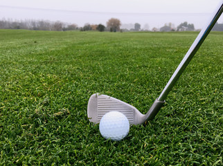 golf iron and ball