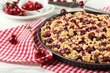 Tasty homemade pie with cherries on table close up