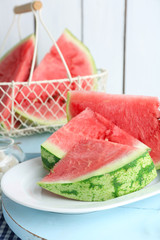 Sliced watermelon on white plate