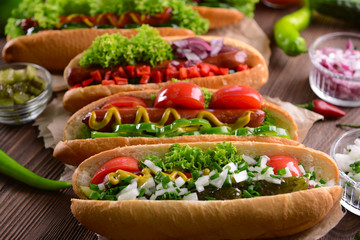 Hot dogs and vegetables on craft paper closeup