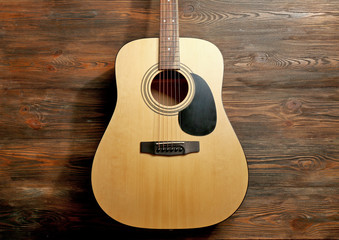 Guitar on wooden background