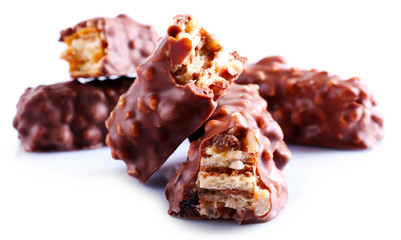 Broken crispy candy bars, isolated on white