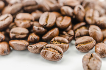 roasted coffee beans isolated on white background