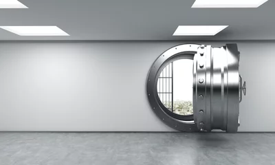 Foto op Canvas open metal safe in bank depository with money on the floor behin © ImageFlow
