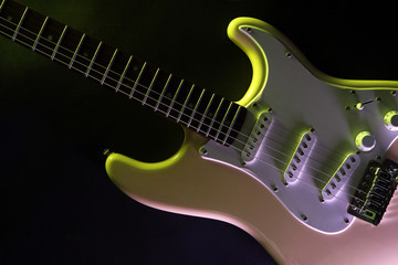 Fototapeta na wymiar Electric guitar, on dark lighted background