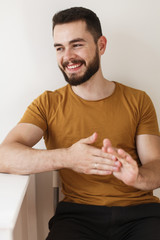 Cheerful young man with a beard