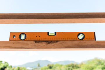 orange building level on the wood
