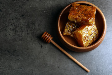 Honeycombs on plate on gray background