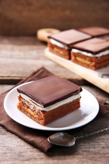 Delicious chocolate brownies on wooden background