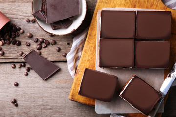 Delicious chocolate brownies on wooden background