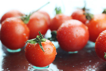 Water drops green and tomatoes