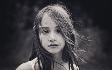 Head shot of girl with windswept hair