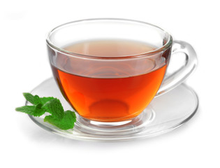 Glass cup of tea with mint leaves isolated on white background