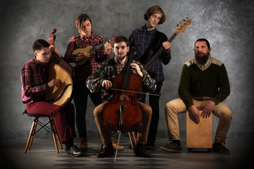 Musical band on grey wall background