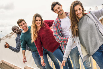 Group of friends having fun together outdoors