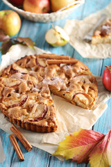 Homemade apple cake on blue wooden table