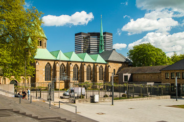 Cathedral in Essen, Germany, and modern business tower, city skyline