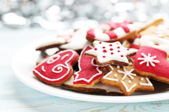 Christmas cookies in plate on a blue wooden table