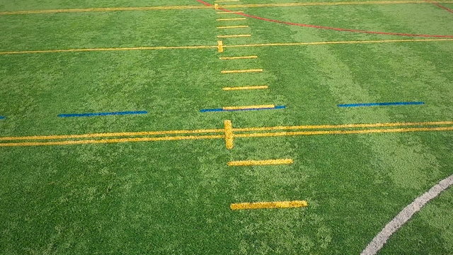 Flying Over an Outdoor Synthetic Football Field