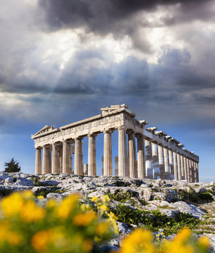 Parthenon temple with spring flowers on the Acropolis in Athens, Greece