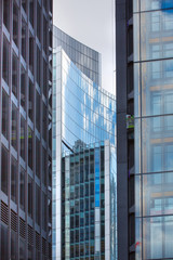 Fototapeta na wymiar LONDON UK - SEPTEMBER 19, 2015 - Modern English architecture, Glass building texture and reflections. City of London 