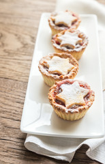 Mince pies with Christmas tree branch