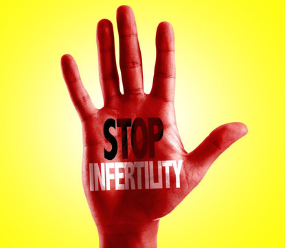 Stop Infertility written on hand with yellow background