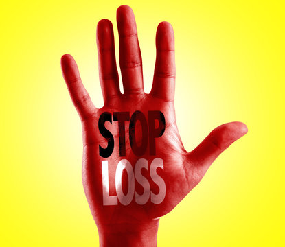 Stop Loss written on hand with yellow background