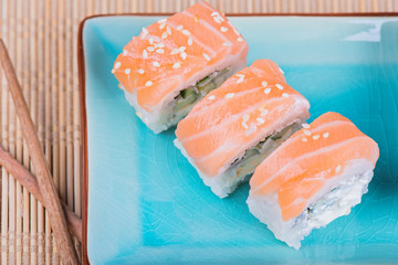 Top view to california maki sushi with salmon