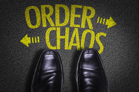 Top View of Business Shoes on the floor with the text: Order - Chaos