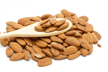 Fototapeta na wymiar A group of almonds. With a wooden spoon