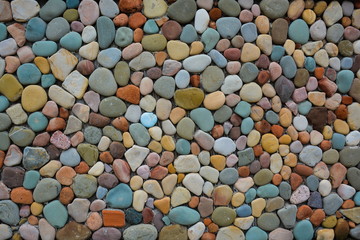 Building wall of coloured stones.