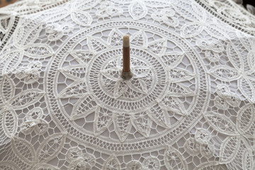 handmade white lace umbrella, close up
