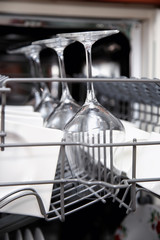 Open dishwasher with clean utensils
