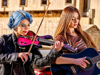 Music street performers with girl violinist 