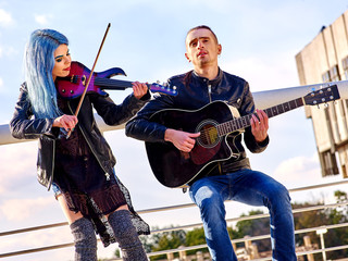 Music street performers with girl violinist 