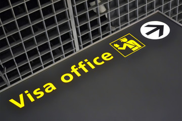 visa office direction sign, airport, immigration travel diversity