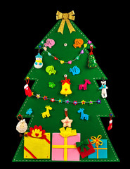Christmas tree with gifts decorated with handmade toys