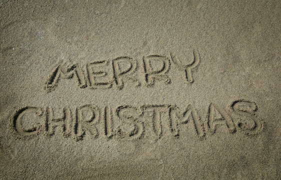 Merry Christmas write in sand
