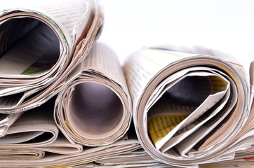 Newspaper/Stack of newspaper on white background.