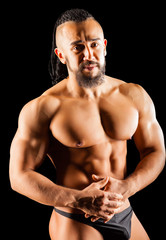 Muscular Young Man in Contrast Light