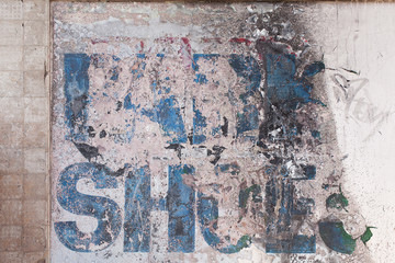Old faded sign on a wall