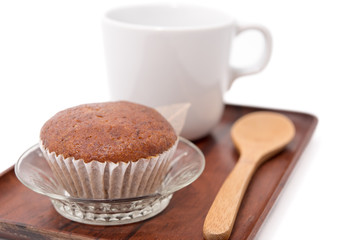 Banana muffin cake and coffee cup on wooden tray isolated on wooden