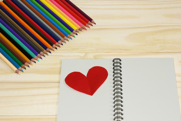 Notebook and colored pencils with Red Heart