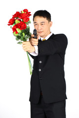 Asian business community Holding a bouquet of roses and a gun. Treacherousness