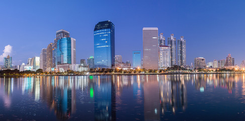 Panorama,Bangkok building at night with  reflection water lights