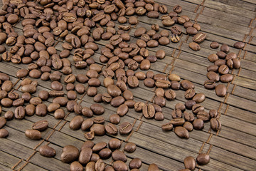 Coffee beans on vintage wooden board