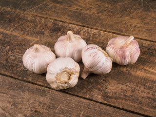 Garlic Heads On Old Wooden Table