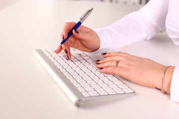 Fototapeta premium Young businesswoman working on a laptop