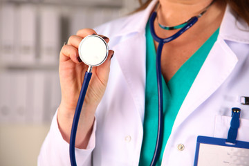 Portrait of happy medical doctor woman in office